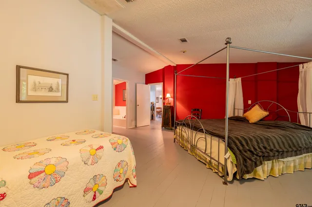 a bedroom with double bed and a hallway