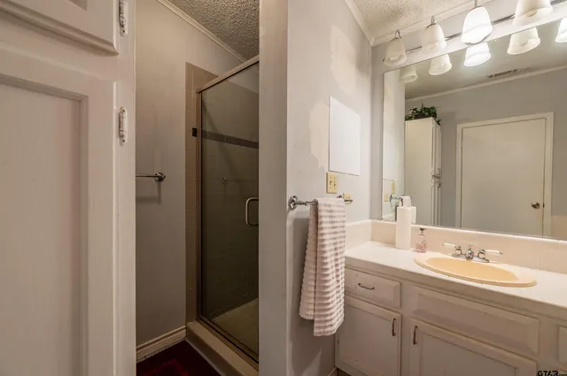 a bathroom with a double vanity sink mirror and double