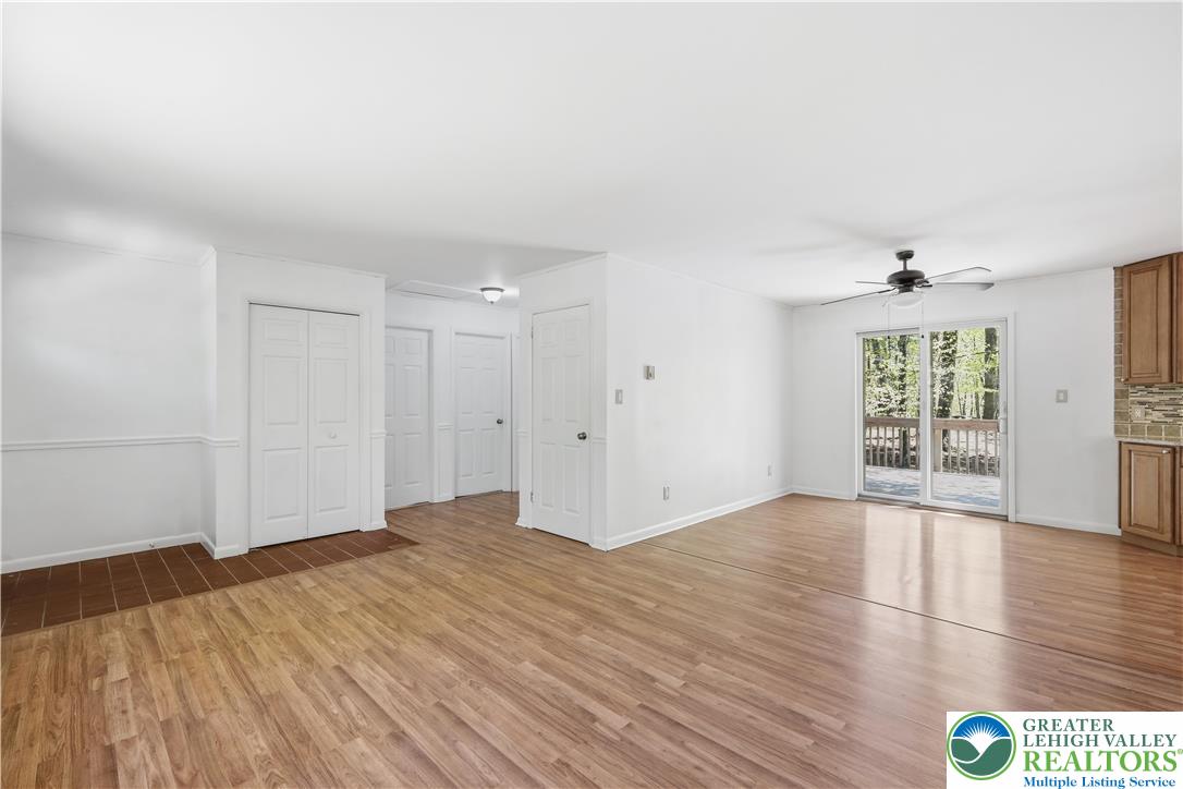 505 Chipmunk Road Bushkill, PA 18324 - Photo 13 of 46 a view of an empty room with wooden floor and a window