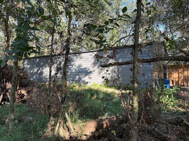 1918 Mountain Lake Cutoff Road Lake Wales, FL 33859 - Photo 22 of 38 a backyard of a house with lots of green space