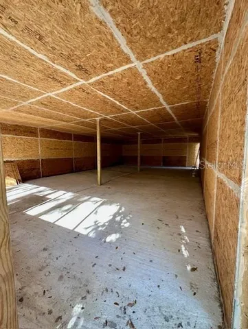 a view of a parking space and a garage