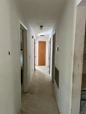 a bathroom with a toilet sink and shower