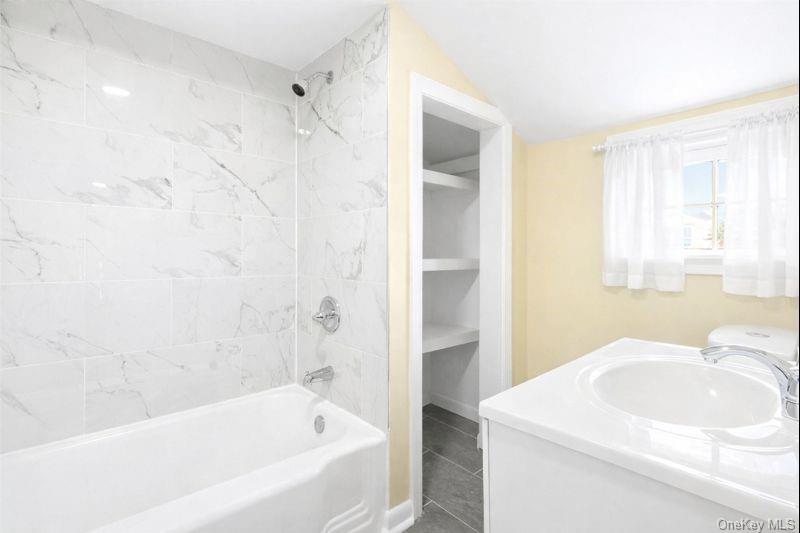 32 North Clover Street Poughkeepsie, NY 12601 - Photo 19 of 20 2nd Floor Full bath with vanity, shower / bath combination, and vaulted ceiling