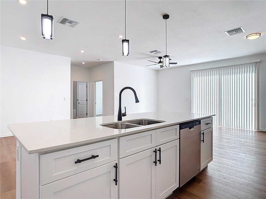 1204 Goshen Road North Port, FL 34288 - Photo 12 of 46 a kitchen with a sink and cabinets