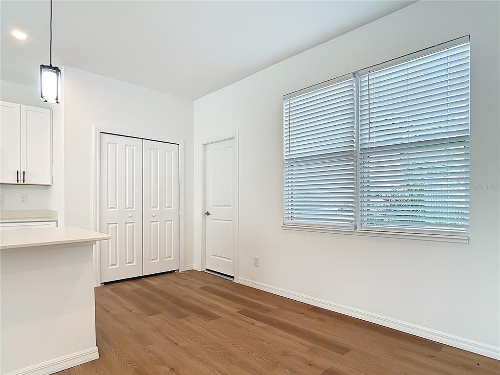 1204 Goshen Road North Port, FL 34288 - Photo 16 of 46 an empty room with wooden floor and windows