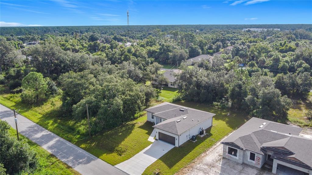 1204 Goshen Road North Port, FL 34288 - Photo 2 of 46 an aerial view of a house with a garden