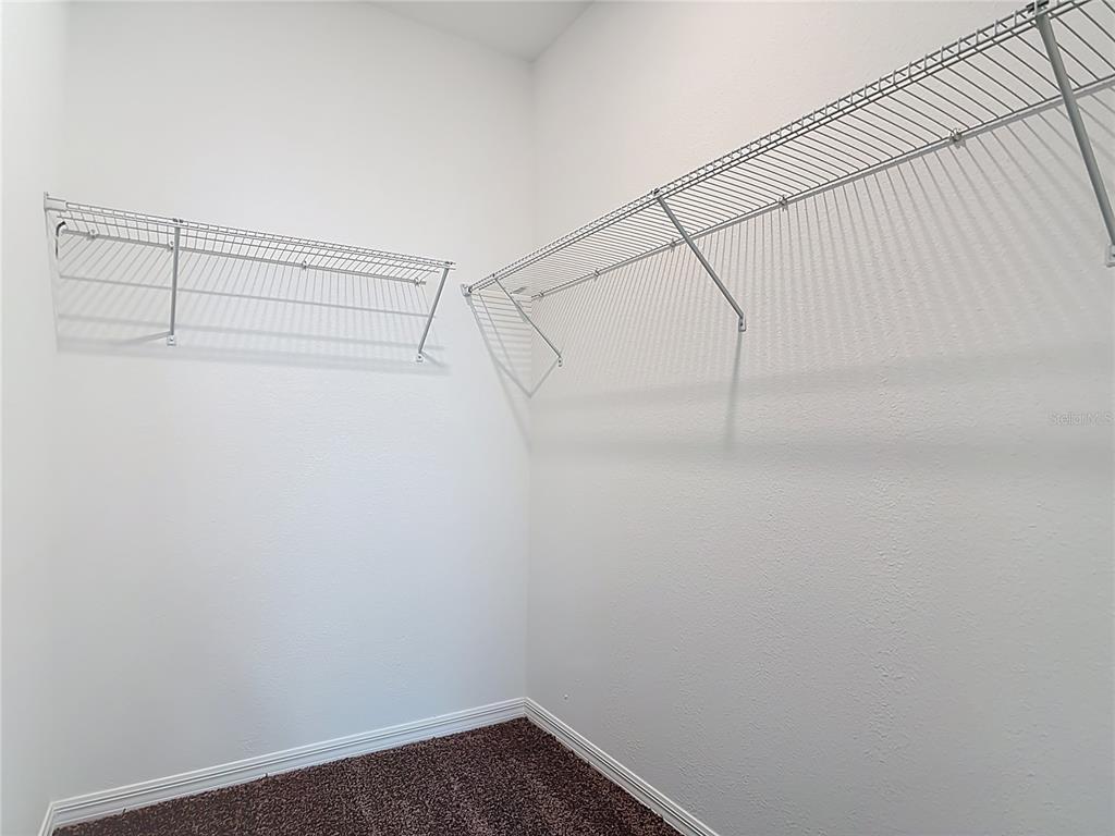 1204 Goshen Road North Port, FL 34288 - Photo 24 of 46 a view of a room with racks on the wall