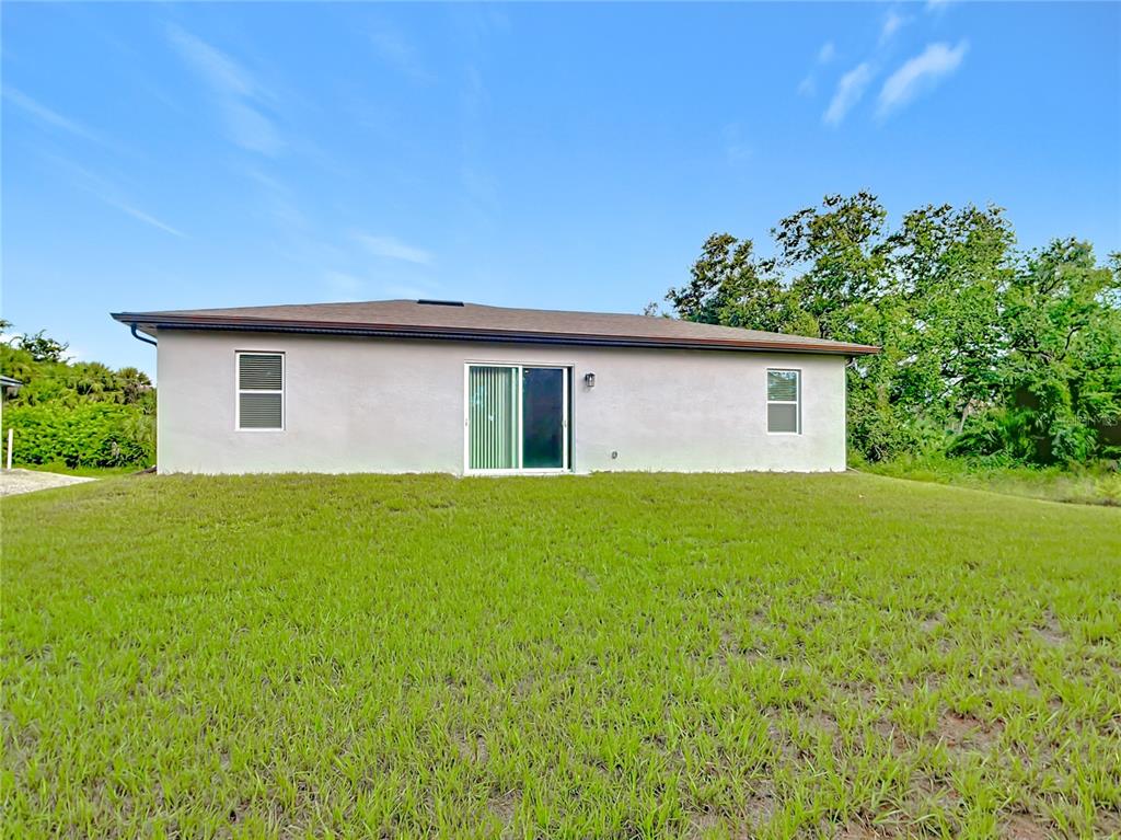 1204 Goshen Road North Port, FL 34288 - Photo 3 of 46 a view of a house with backyard and garden