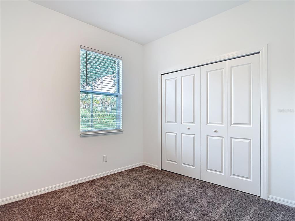 1204 Goshen Road North Port, FL 34288 - Photo 32 of 46 an empty room with windows