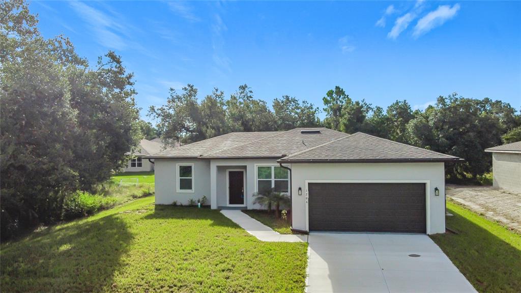 1204 Goshen Road North Port, FL 34288 - Photo 36 of 46 a front view of a house with garden