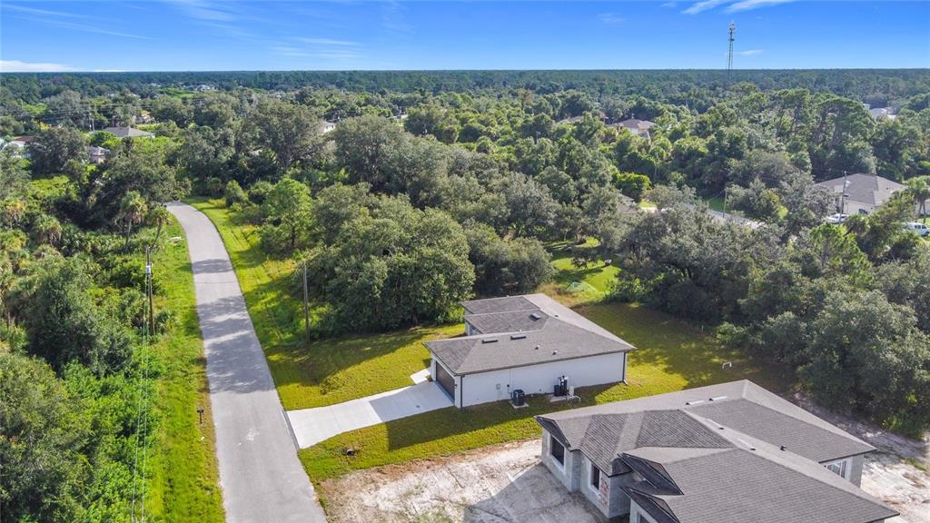 1204 Goshen Road North Port, FL 34288 - Photo 41 of 46 an aerial view of a house with a garden
