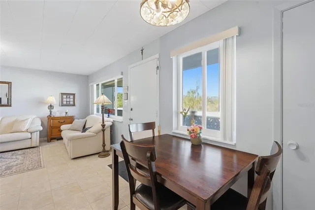 a view of a dining room with furniture and a window