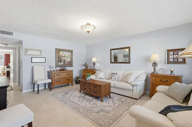 a living room with furniture and a table