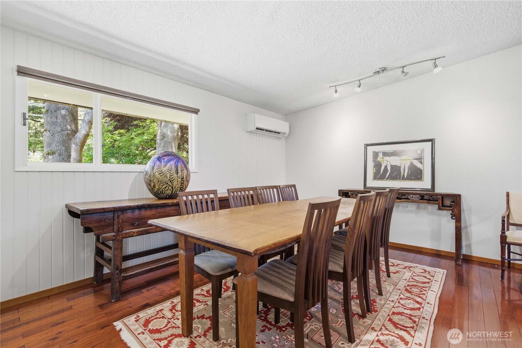 3050 Southeast Mullenix Road Port Orchard, WA 98367 - Photo 23 of 40 a view of a dining room with furniture window and wooden floor