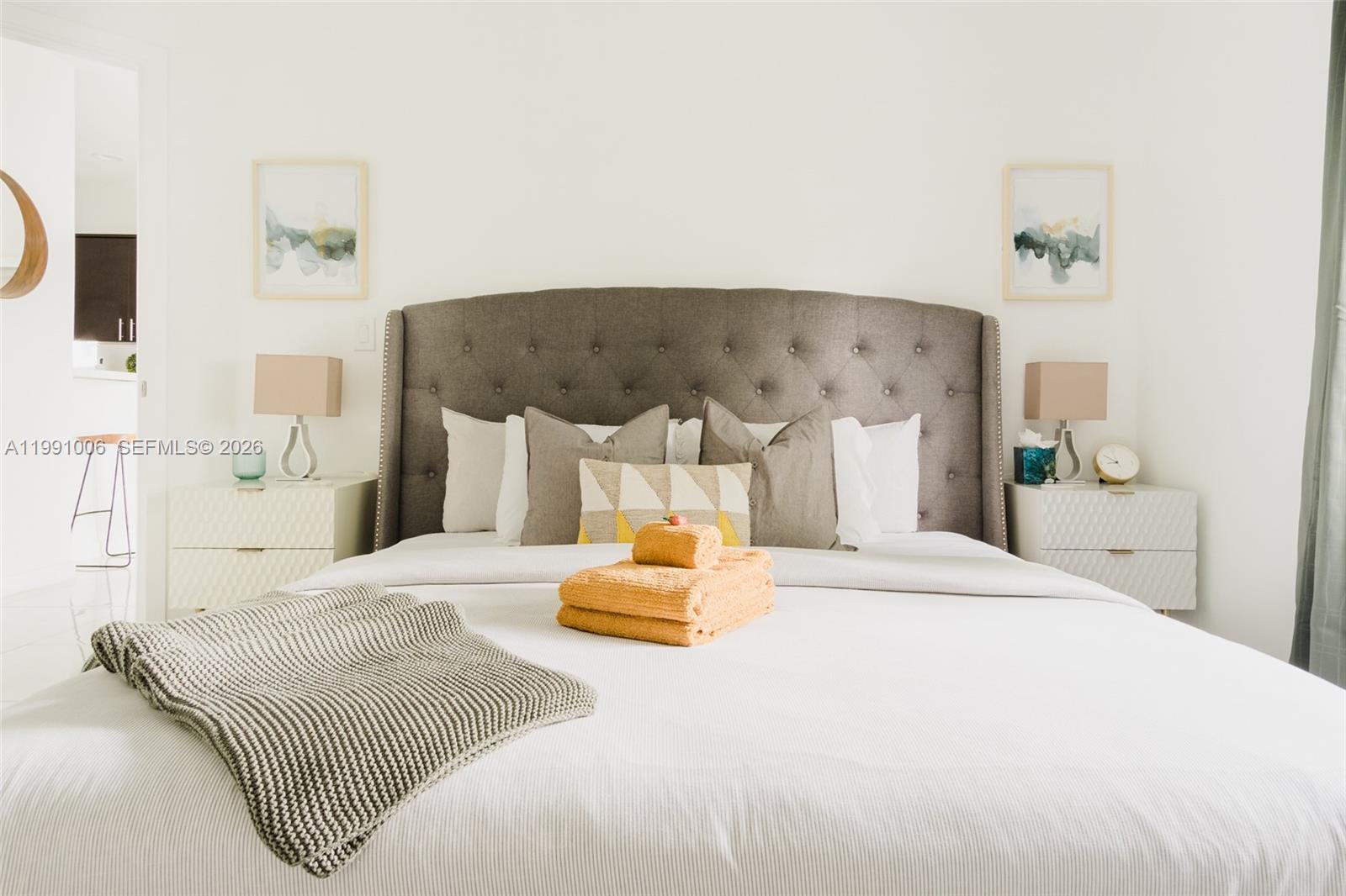 8765 Northwest 22nd Place Miami, FL 33147 - Photo 15 of 37 a bedroom with a bed and a night stand