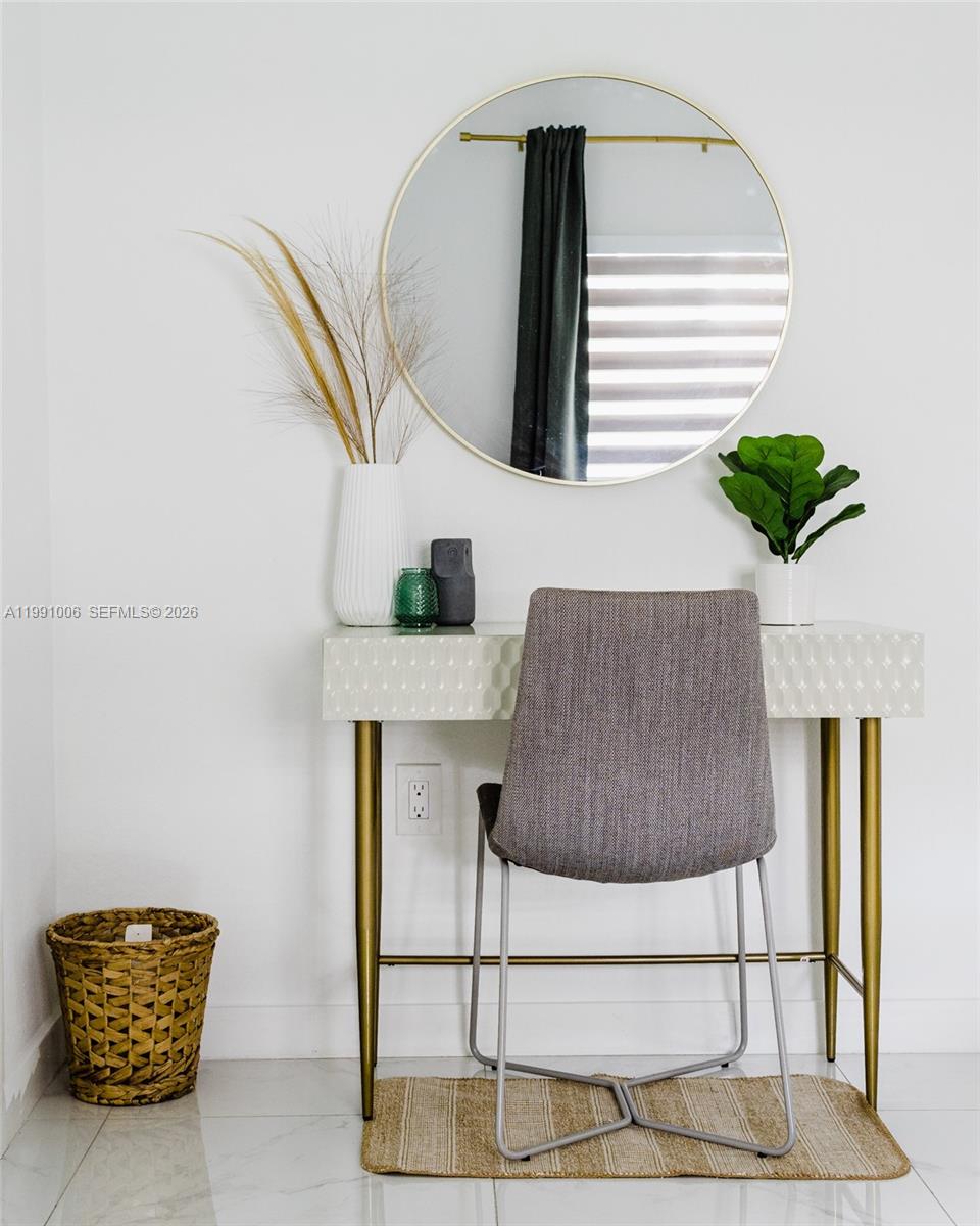 8765 Northwest 22nd Place Miami, FL 33147 - Photo 19 of 37 a living room with a rug and a potted plant