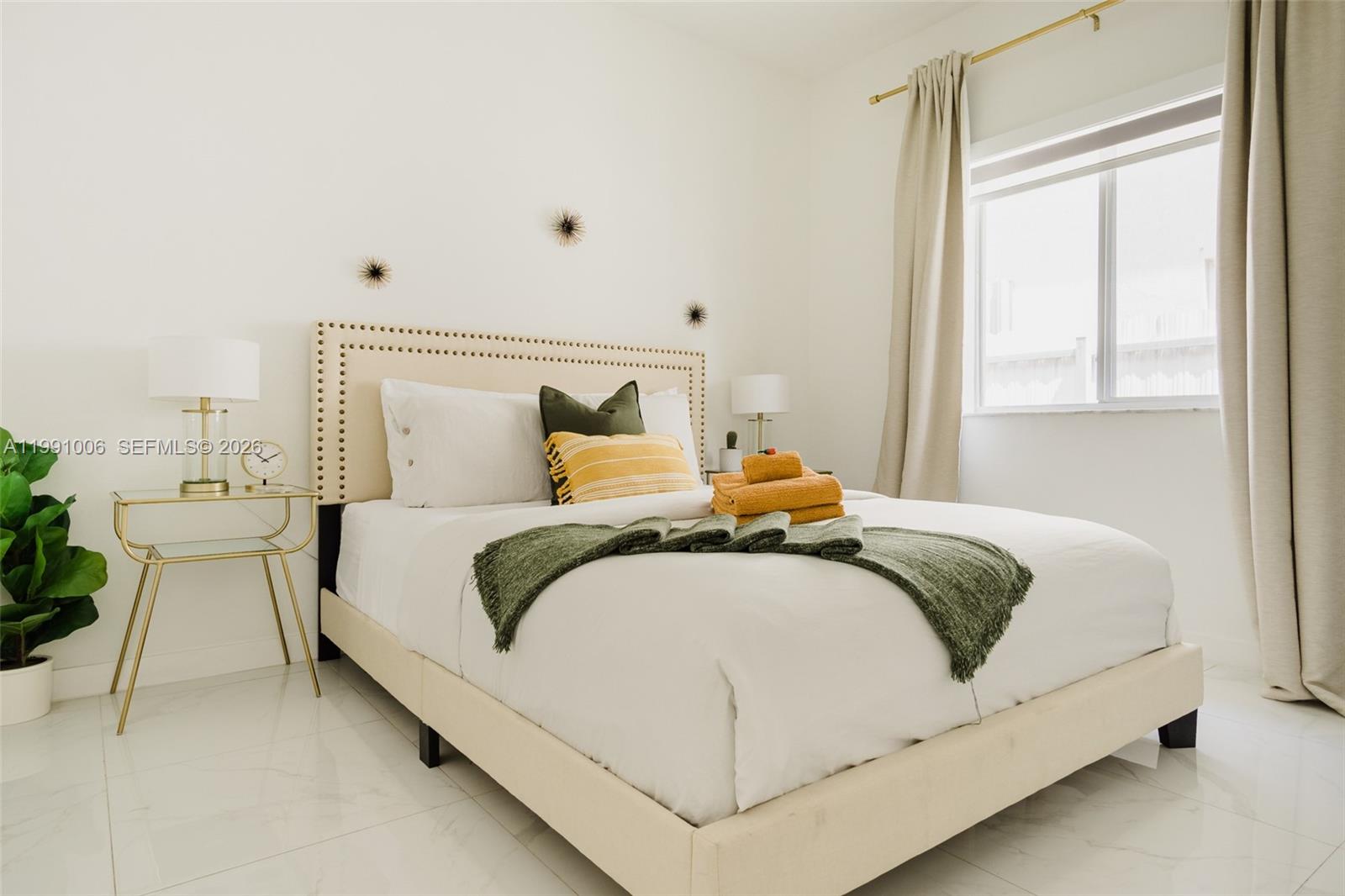 8765 Northwest 22nd Place Miami, FL 33147 - Photo 21 of 37 a bedroom with a bed and window