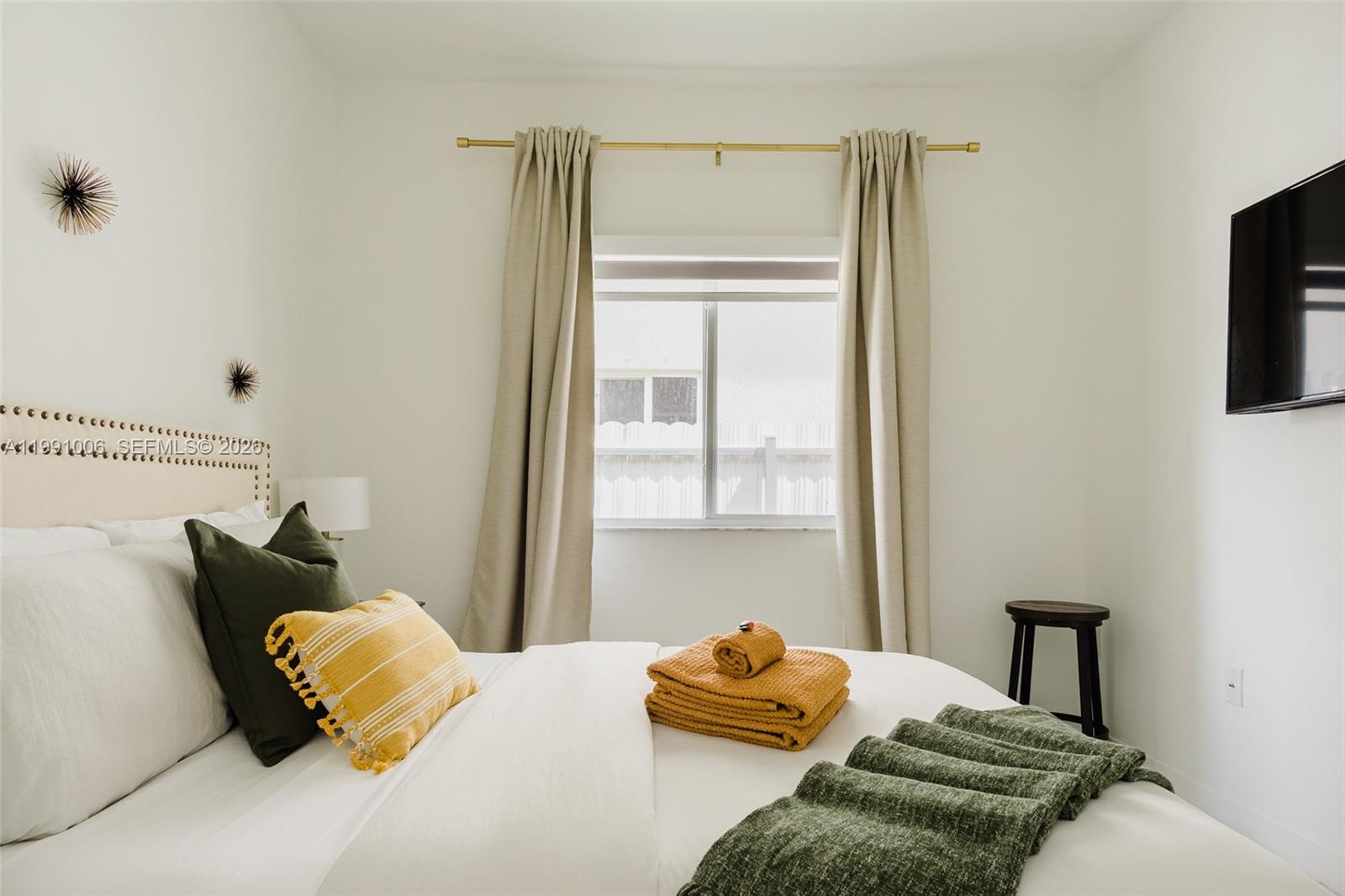 8765 Northwest 22nd Place Miami, FL 33147 - Photo 22 of 37 a bedroom with a bed and dresser