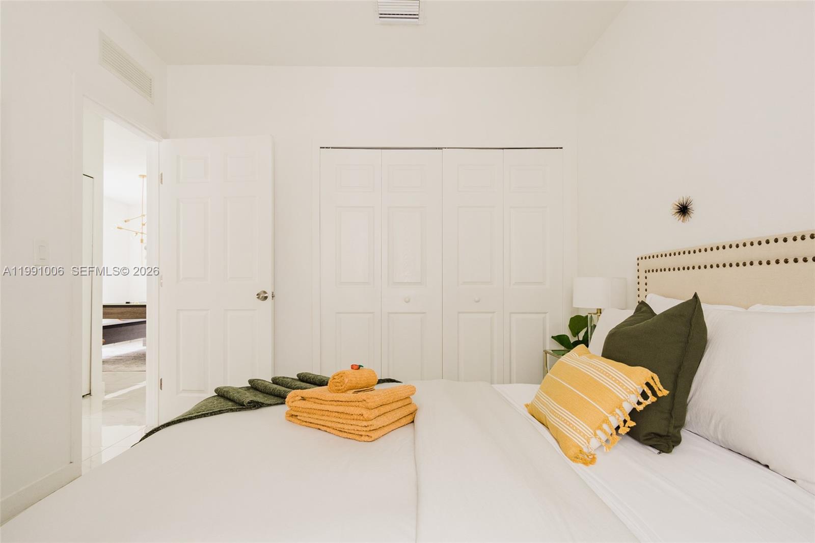 8765 Northwest 22nd Place Miami, FL 33147 - Photo 24 of 37 a bedroom with a bed and a couch