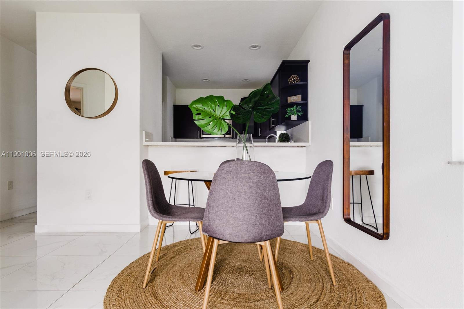 8765 Northwest 22nd Place Miami, FL 33147 - Photo 3 of 37 a view of a dining room with furniture and wooden floor