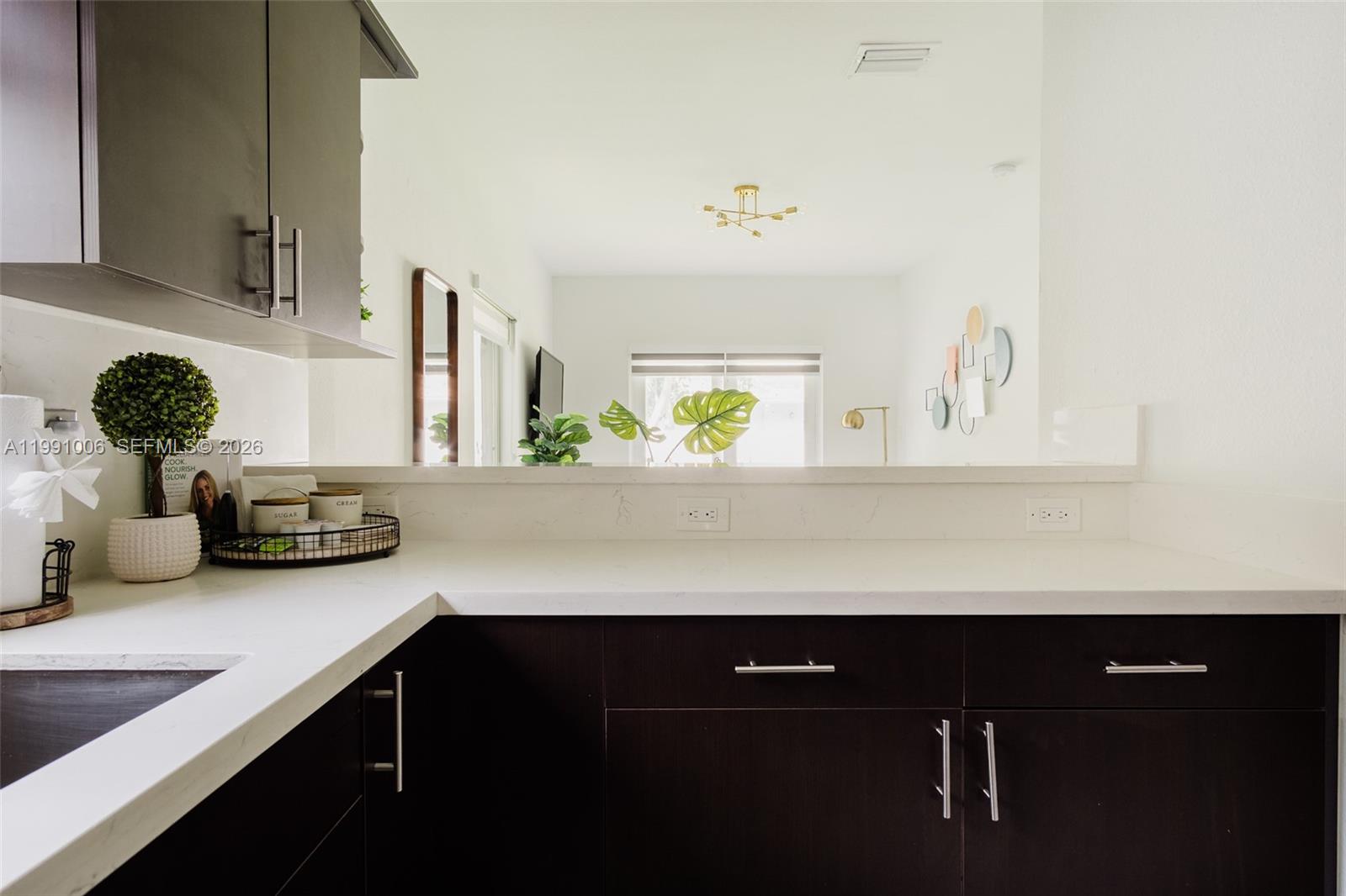 8765 Northwest 22nd Place Miami, FL 33147 - Photo 33 of 37 a kitchen with a sink and cabinets