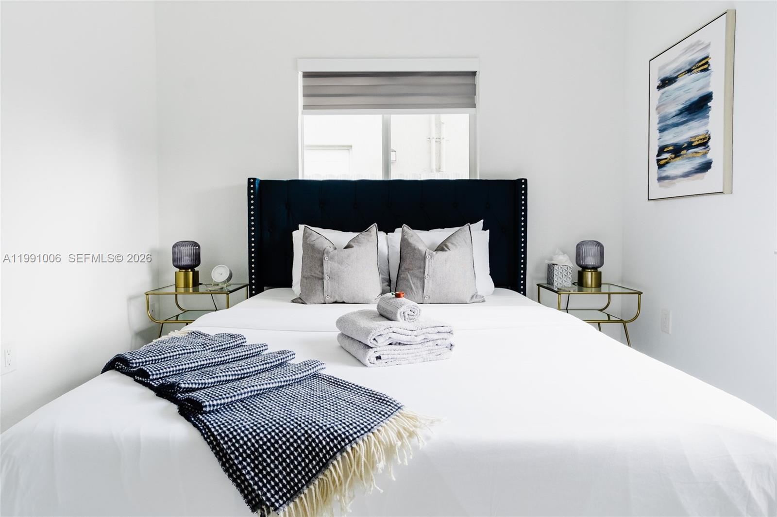 8765 Northwest 22nd Place Miami, FL 33147 - Photo 9 of 37 a bedroom with bed and window