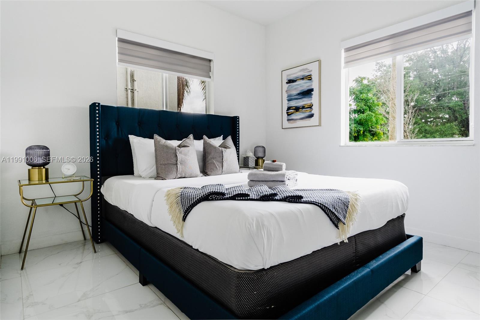 8765 Northwest 22nd Place Miami, FL 33147 - Photo 10 of 37 a bedroom with bed and window