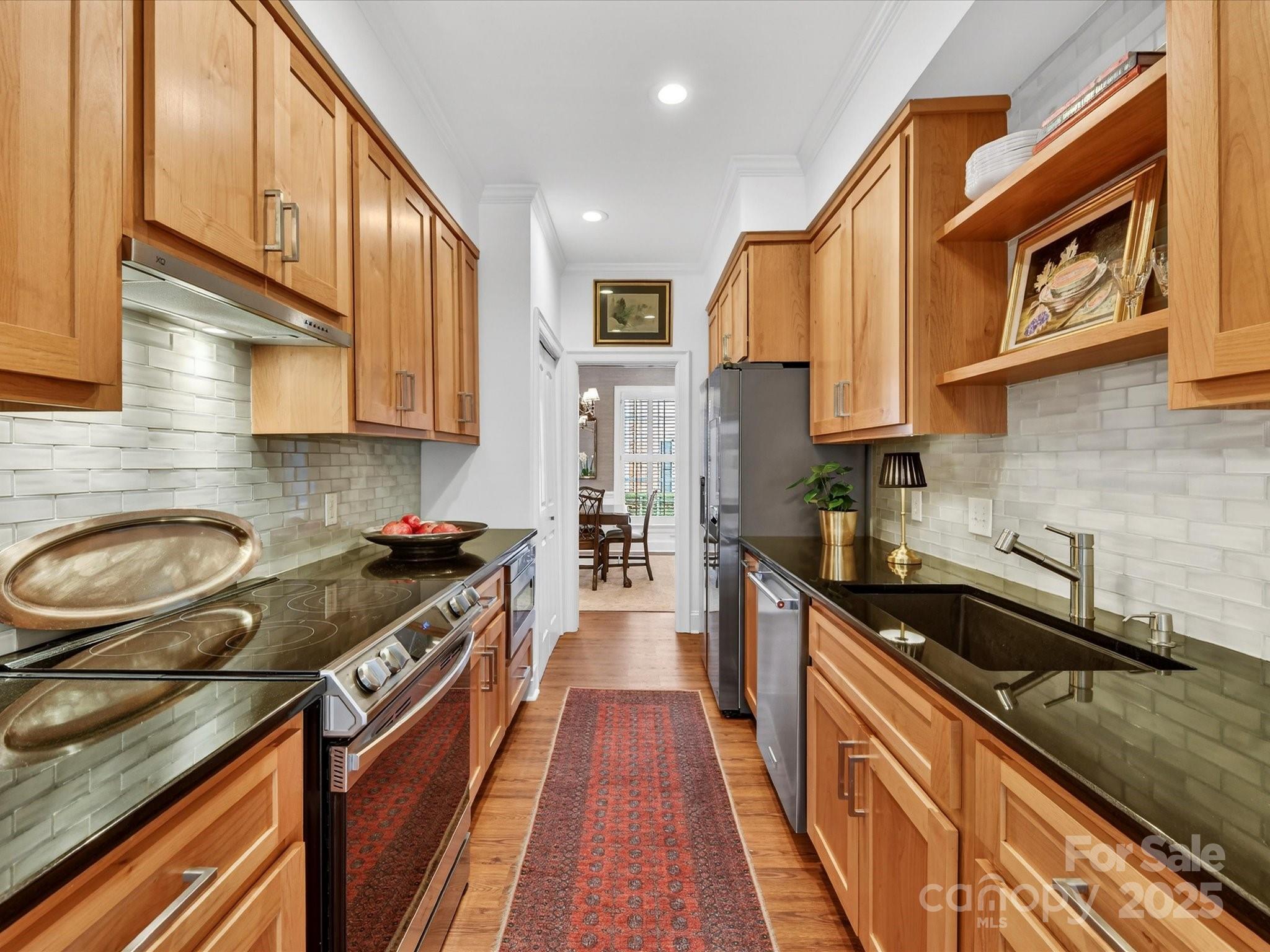 2813 Sharon View Road Charlotte, NC 28210 - Photo 12 of 40 a kitchen with a sink a stove and cabinets