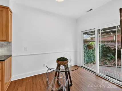 a view of a livingroom with furniture and wooden floor