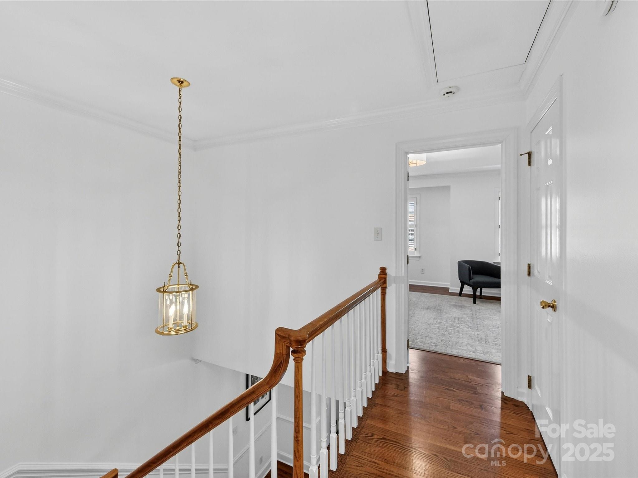 2813 Sharon View Road Charlotte, NC 28210 - Photo 21 of 40 a view of a hallway with wooden floor and livingroom view