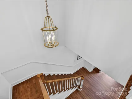 a view of a chandelier in hallway