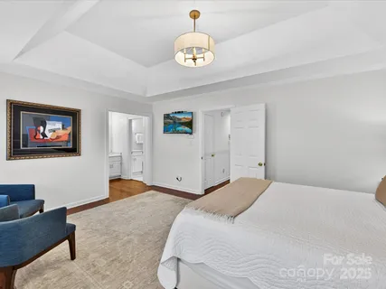 a bedroom with a bed and a couch