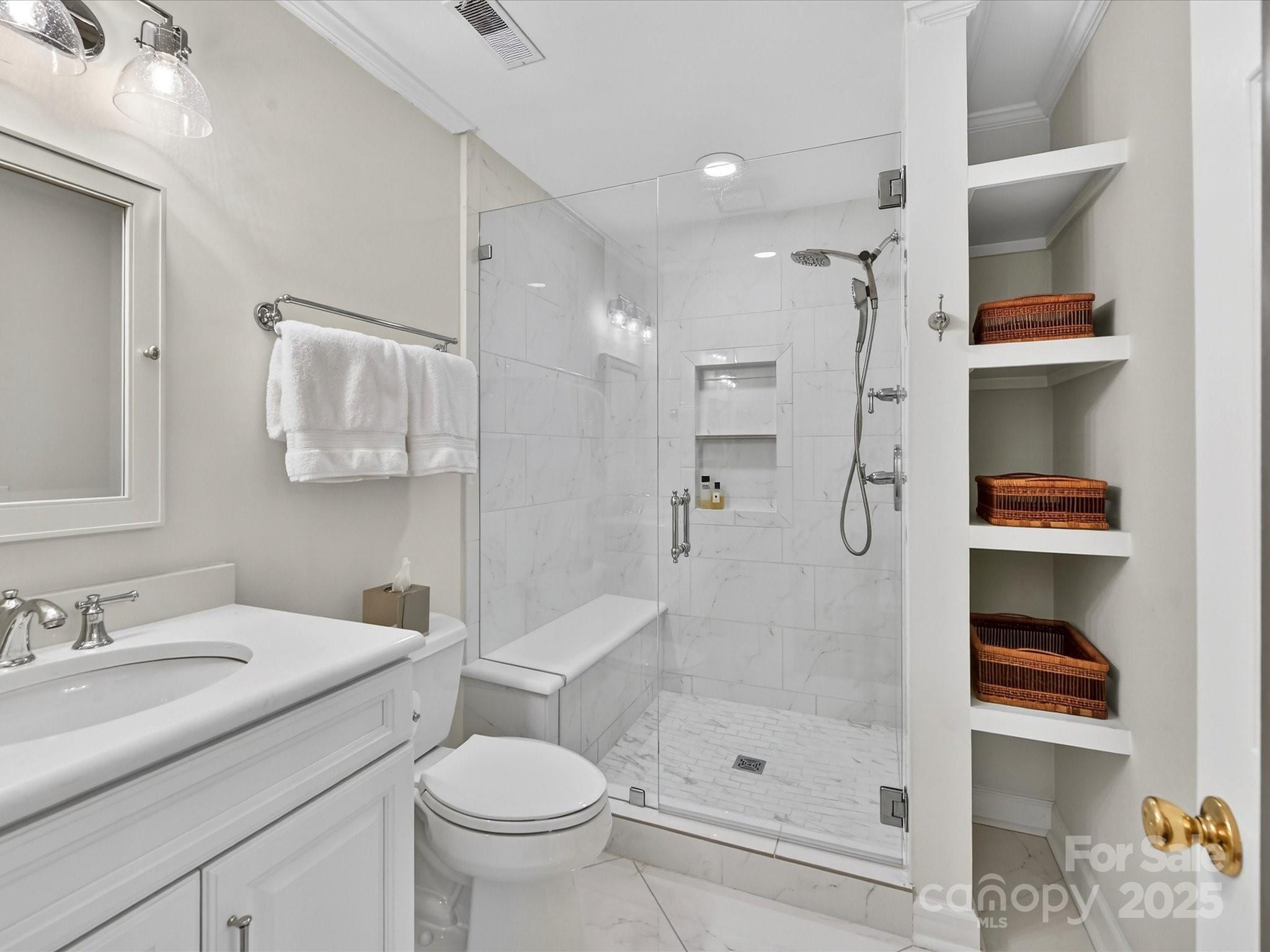 2813 Sharon View Road Charlotte, NC 28210 - Photo 26 of 40 a bathroom with a sink toilet and shower