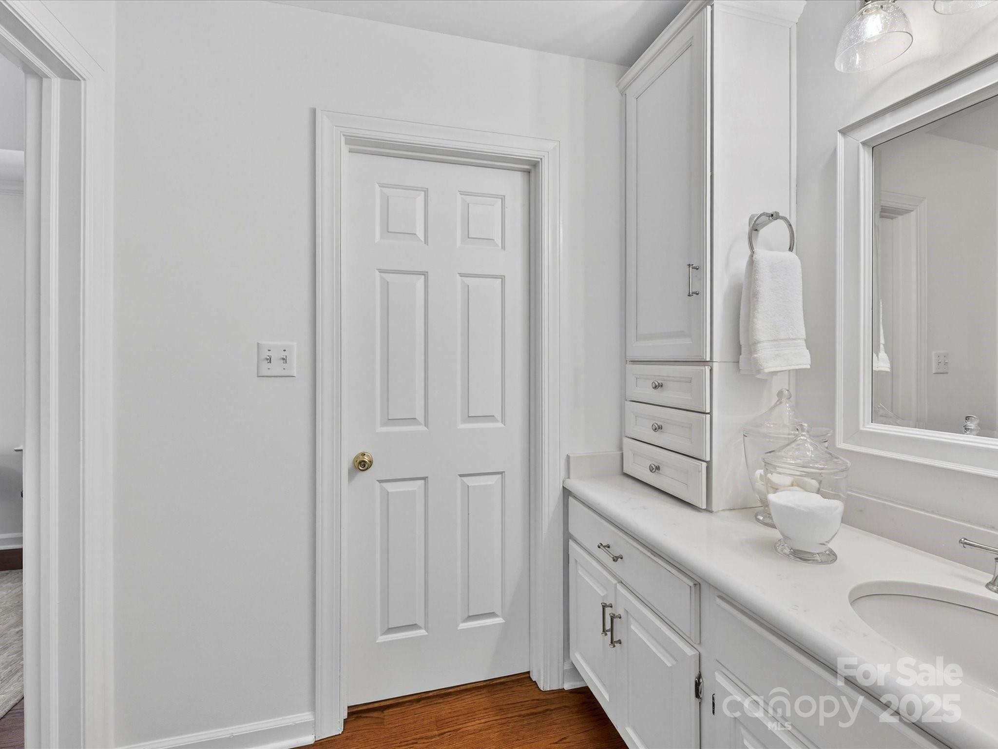 2813 Sharon View Road Charlotte, NC 28210 - Photo 27 of 40 a bathroom with cabinets granite and a sink