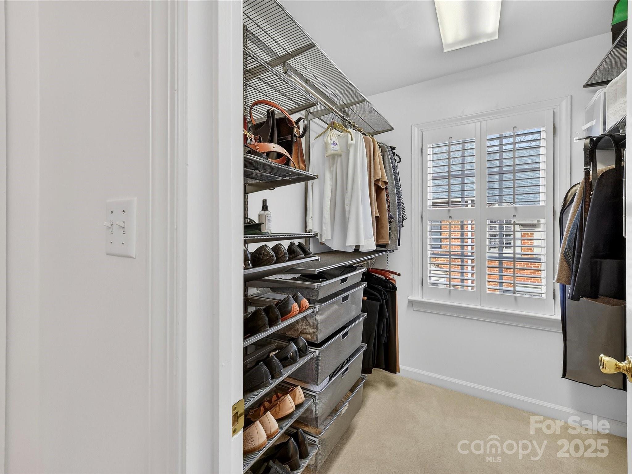 2813 Sharon View Road Charlotte, NC 28210 - Photo 28 of 40 a view of walk in closet with clothes and shoes