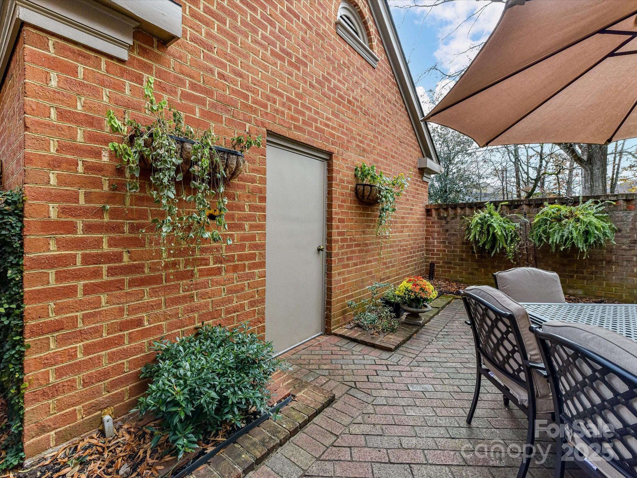 2813 Sharon View Road Charlotte, NC 28210 - Photo 38 of 40 a backyard of a house with outdoor seating