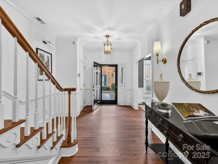 a view of an entryway with wooden floor