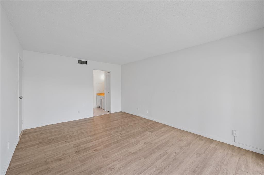 8105 Northwest 61st Street, Unit A206 Tamarac, FL 33321 - Photo 12 of 44 a view of an empty room and window