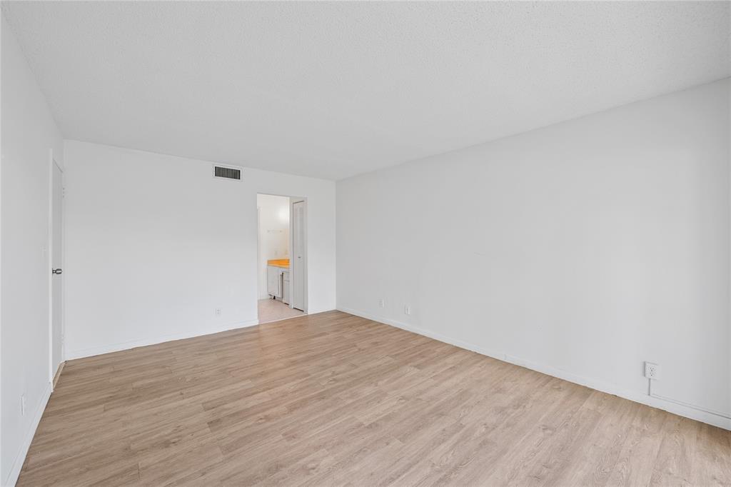 8105 Northwest 61st Street, Unit A206 Tamarac, FL 33321 - Photo 13 of 44 a view of an empty room and window