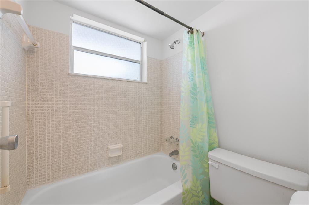 8105 Northwest 61st Street, Unit A206 Tamarac, FL 33321 - Photo 16 of 44 a bathroom with a toilet and a bathtub