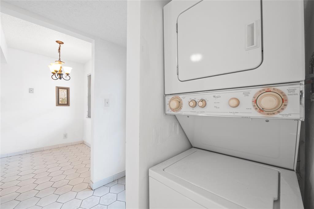 8105 Northwest 61st Street, Unit A206 Tamarac, FL 33321 - Photo 25 of 44 a utility room with dryer and washer