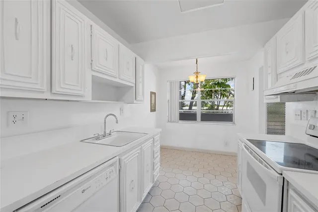 a bathroom with a bathtub sink and mirror