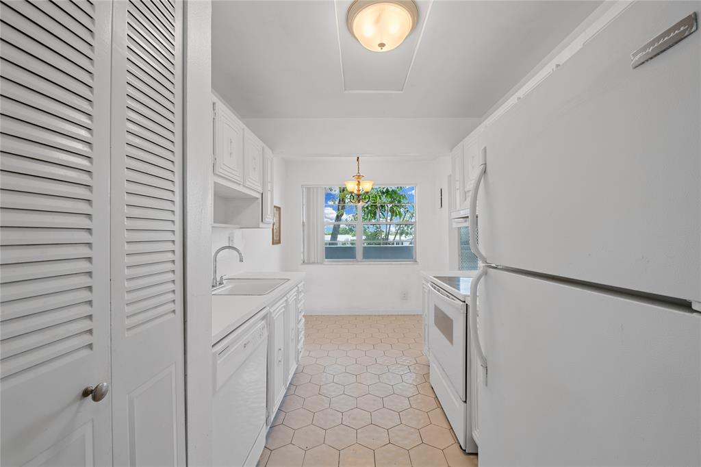 8105 Northwest 61st Street, Unit A206 Tamarac, FL 33321 - Photo 35 of 44 a bathroom with a bathtub sink and mirror