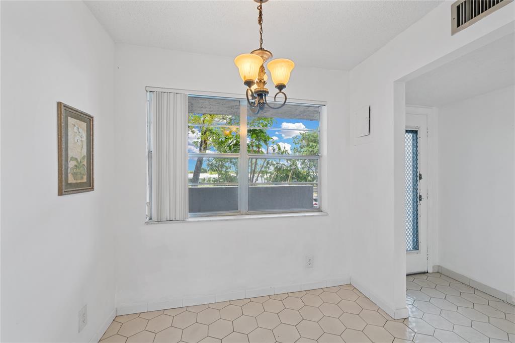 8105 Northwest 61st Street, Unit A206 Tamarac, FL 33321 - Photo 37 of 44 a window in a room