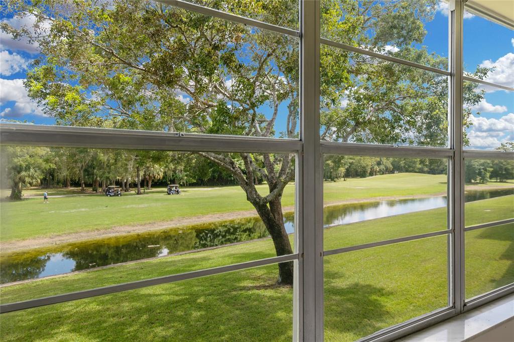 8105 Northwest 61st Street, Unit A206 Tamarac, FL 33321 - Photo 38 of 44 a view of yard from a window