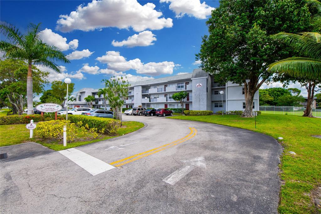 8105 Northwest 61st Street, Unit A206 Tamarac, FL 33321 - Photo 39 of 44 a view of a house with swimming pool