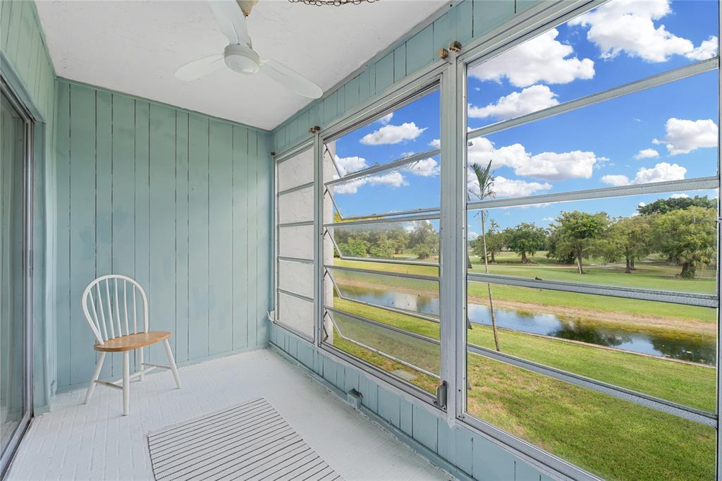 8105 Northwest 61st Street, Unit A206 Tamarac, FL 33321 - Photo 42 of 44 a view of room with window and outdoor view