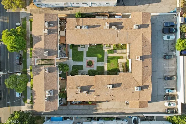 aerial view of a house with a yard
