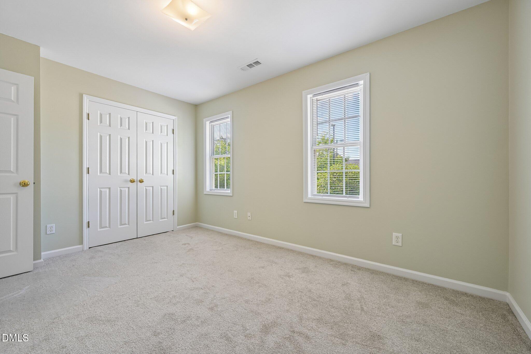 278 South Raleigh Street Angier, NC 27501 - Photo 23 of 35 an empty room with windows