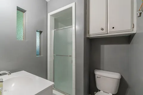 a bathroom with a toilet and a sink